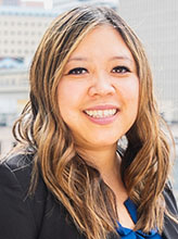 Professional headshot portrait of Aleenna