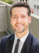 Professional headshot portrait of Philip