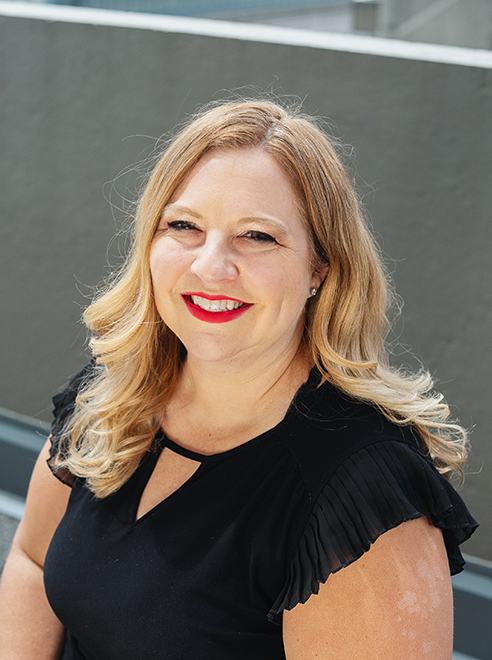 Professional headshot portrait of Stacy