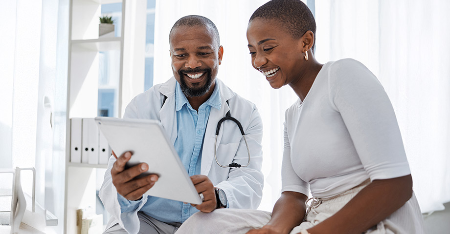 A doctor and patient looking over a chart