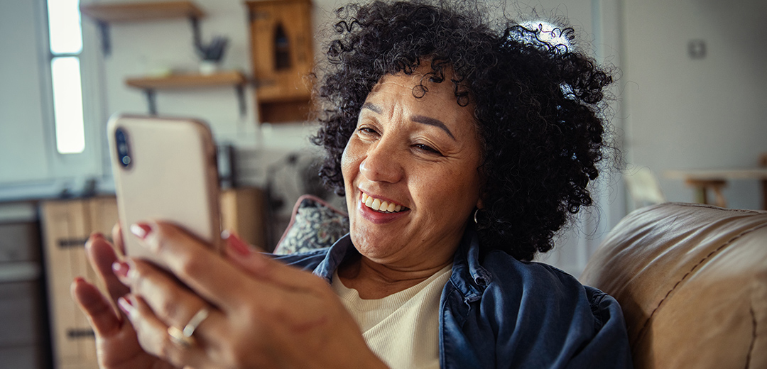 A woman on her phone asking about menopause.