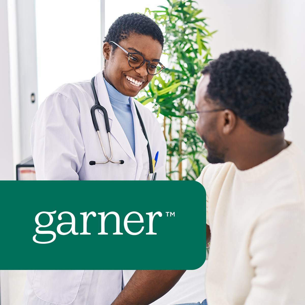 Smiling doctor caring for Garner patient