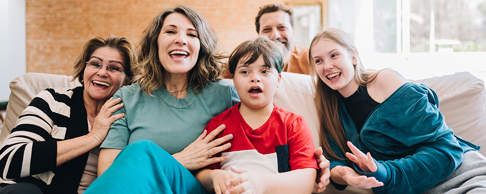 Multiple generations of family members on couch