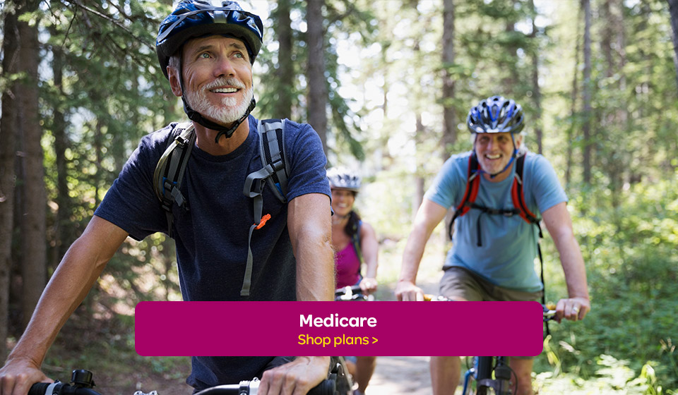 Senior bikers smile knowing they are covered by Moda Health Medicare insurance.