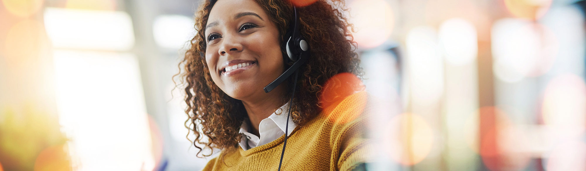 A woman smiling while one the phone