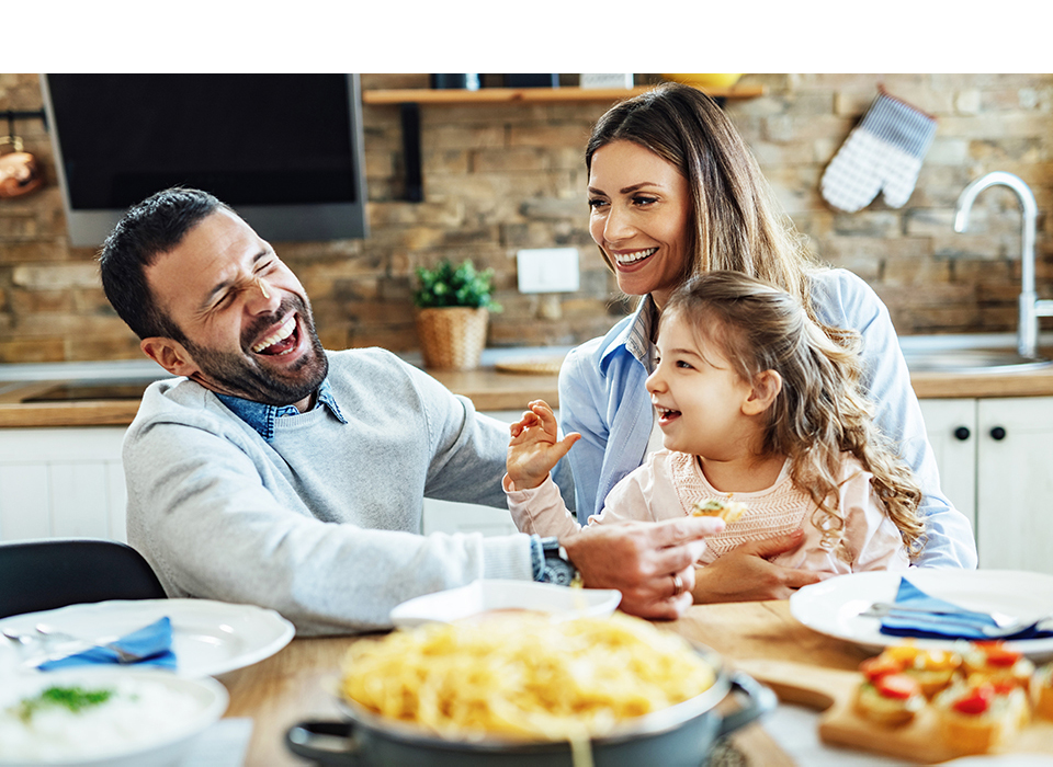 A family eating dinner at the table