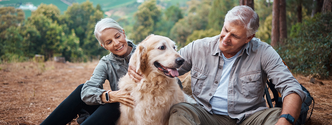 Two people with a dog